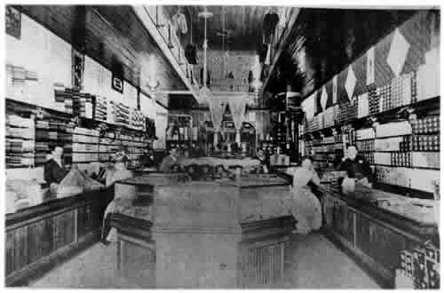 Inside the store: long counters and shelves of goods